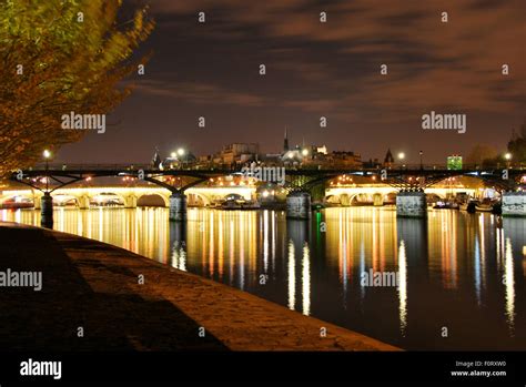 Bridge in Paris by night Stock Photo - Alamy