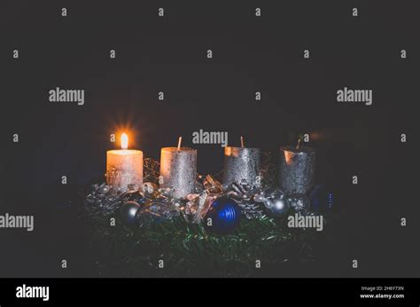 1. advent concept with one glowing burning candle Stock Photo - Alamy