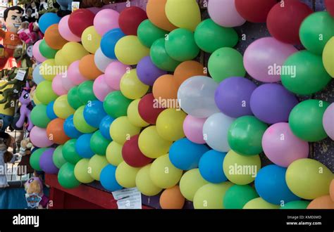 Pop the balloon dart game at a carnival or fair Stock Photo: 167499037 ...