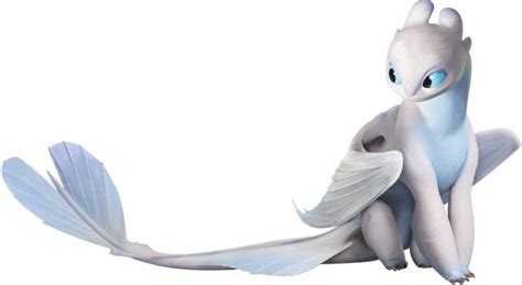 a white dragon with blue eyes sitting on the ground and looking at something off to the side