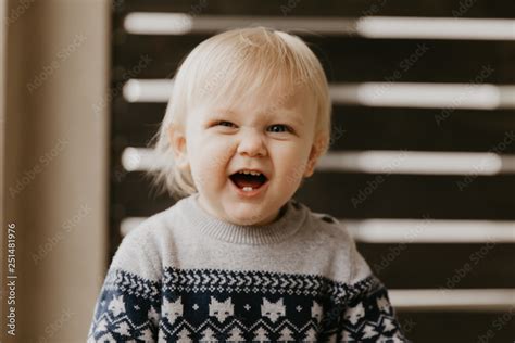 Cute Adorable Little Blonde Toddler Kid Laughing, Having Fun, and Making Silly Faces Outside at ...