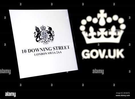 UK Prime Minister's Office logo glowing on the smartphone screen and ...