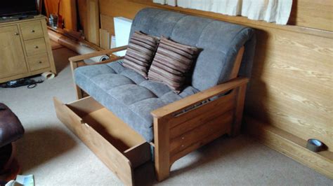 Faringdon small sofa bed with storage drawer | Futon living room, Sofa ...
