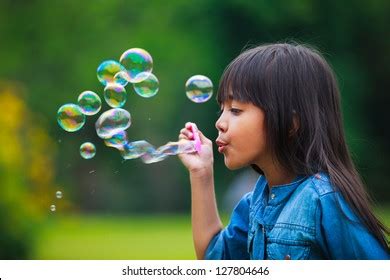 2,899 Young Asian Girl Blowing Bubble Stock Photos, Images ...