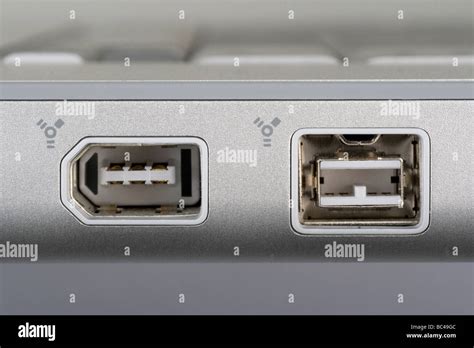 Firewire 400 and 800 ports on a notebook computer Stock Photo - Alamy