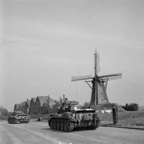 Cromwell tanks of Guard's Armoured Division drive along 'Hell's Highway' towards Nijmegen during ...