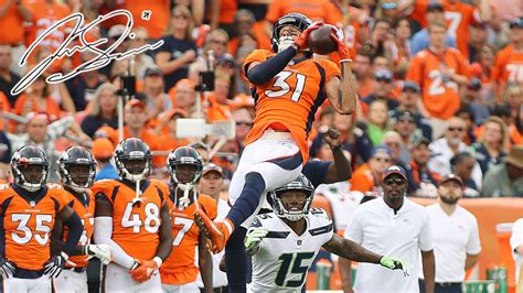 Denver Bronco Justin Simmons intercepts Seahawk QB Russell Wilson's pass in front of Denver fans ...