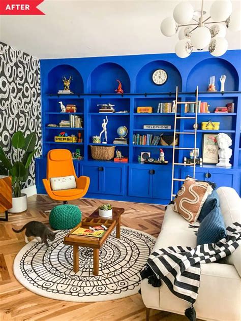 a living room filled with furniture and blue shelves