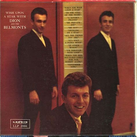 two men in suits standing next to each other on the cover of a record album