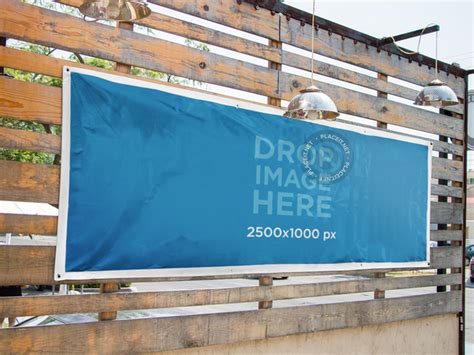 Placeit - Horizontal Banner Mockup Nailed to a Wooden Wall