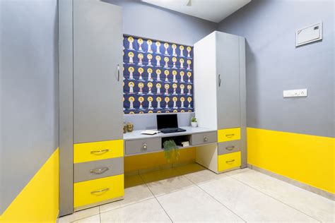 Yellow And Grey Home Office Design With A White Table | Livspace