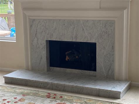 Finished Carrara Marble Fireplace