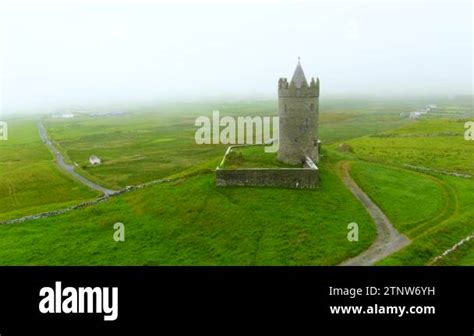 Doonagore Castle aerial foggy view, iconic landmark, one of the most ...