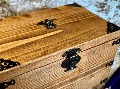 A dice solid wood chest featuring a DnD Dragon. Dice Box