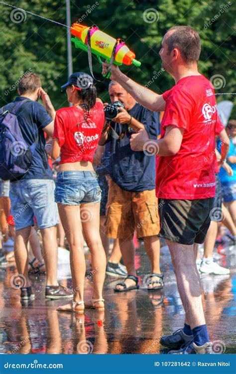 Young People with Soaking Wet Clothes and Hair Playing with Water ...