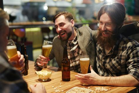 Men Laughing and Drinking Beer · Free Stock Photo
