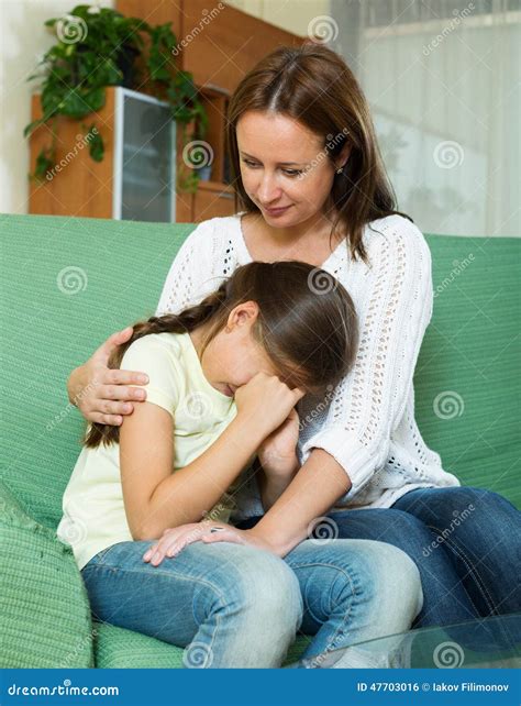 Woman Comforting Crying Daughter Stock Photo - Image of home, adolescence: 47703016