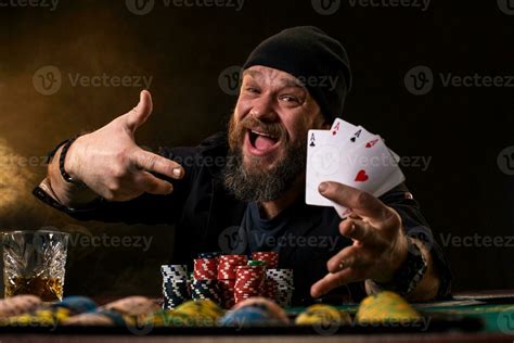 Bearded man with cigar and glass sitting at poker table and screaming isolated on black 36714999 ...