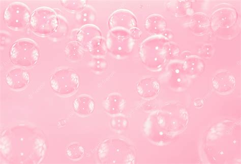 Premium Photo | Soap bubbles float on pink