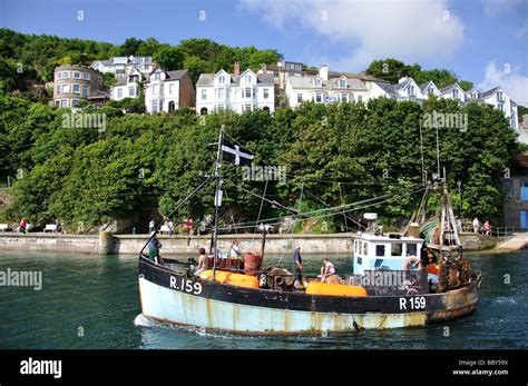 Fishing boat leaving harbour, Looe, Cornwall, England, United Kingdom ...