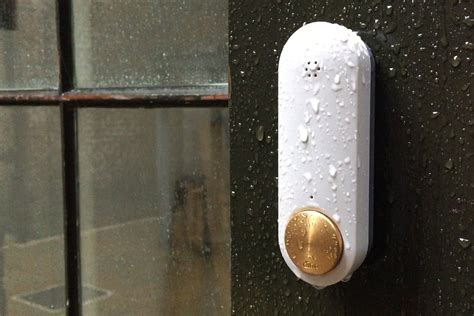 Our Ome Smart Doorbell in spun brass, looking good on a rainy London day and loving the downpour ...