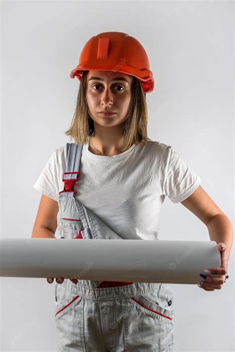 Premium Photo | Woman in construction uniform helmet on her head posing isolated on white background