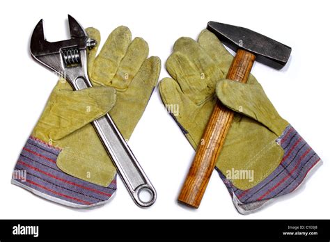 Hammer, crescent wrench and pair of work gloves Stock Photo - Alamy