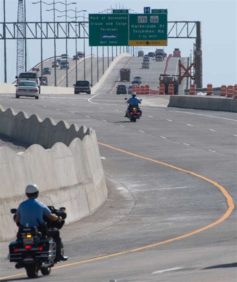 I-45 Causeway into Galveston named after George, Cynthia Woods Mitchell