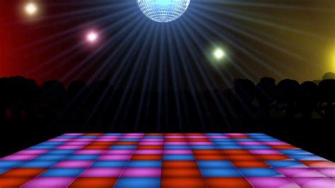 a brightly lit dance floor in front of a stage with disco lights and trees on the other side