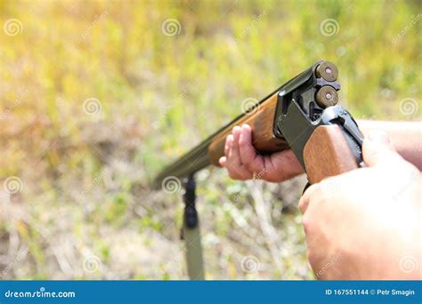 Hunter Holding a Gun Close Up. Stock Photo - Image of holding, mans ...