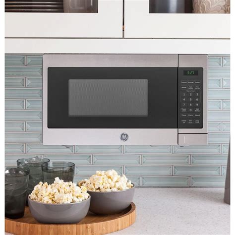 GE 0.7 cu. ft. Small Countertop Microwave in Stainless Steel ...