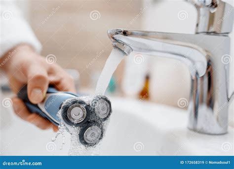 Man Cleans Electric Razor after Shaving Stock Image - Image of closeup, bath: 172658319