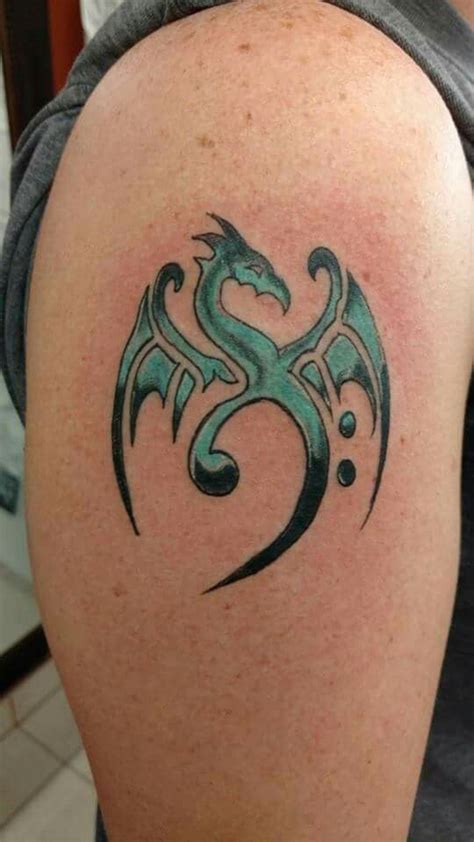 Dragon bass clef! | Tattoos, Drum tattoo, Music tattoos