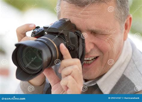 Senior Man with a DSLR Camera Stock Image - Image of digital, male: 29314167