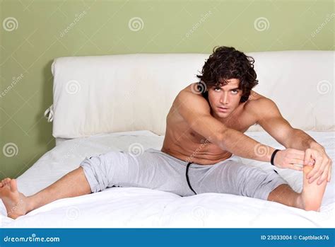 Bed stretching stock photo. Image of muscular, beautiful - 23033004