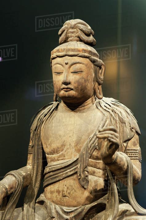 Buddhist statue;Tokyo japan - Stock Photo - Dissolve