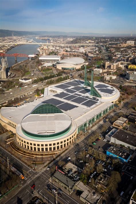 an aerial view of a large building with solar panels on it's roof and ...