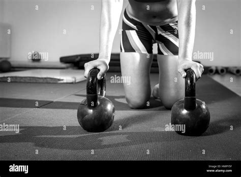 Fitness woman doing kettlebell pushup exercise at gym Stock Photo - Alamy