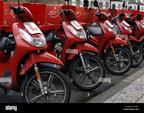 A line of Pizza Hut delivery bikes parked in a street in Fulham, London ...