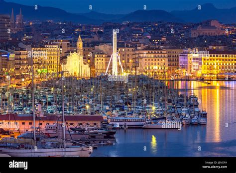 Vieux port and notre dame de la garde by night hi-res stock photography ...