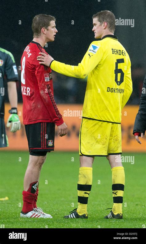 Dortmund's Sven Bender (R) and his twin Leverkusen's Lars Bender chat after the German ...