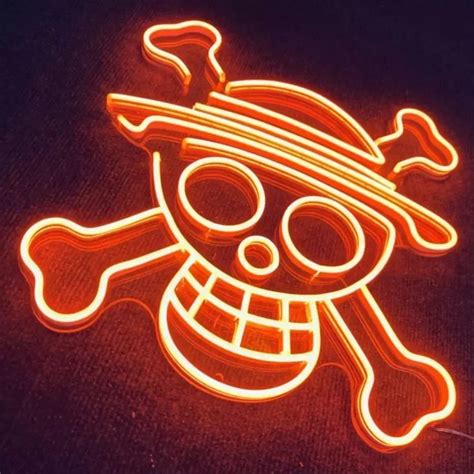 a neon sign with a skull and crossbones on the bottom is lit up