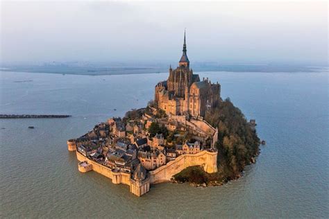 Stone castle on the oasis of Mont Saint-Michel, France | World heritage sites, Wonders of the ...