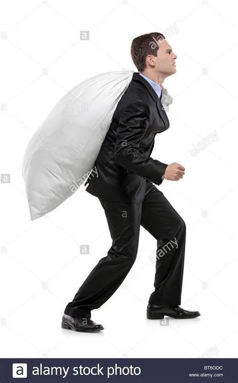 Portrait of a Businessman Carrying a Money Bag