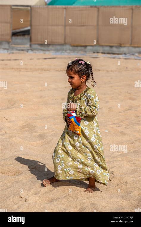 Barefoot young girl in a Bedouin camp, Southern Oman Stock Photo - Alamy