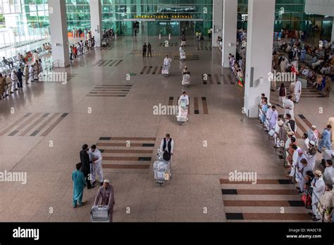 Travelers at International Arrivals lounge area of Islamabad ...