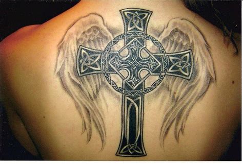 A Celtic cross tattoo with angel wings celebrates both Christianity and a European heritage ...