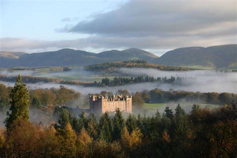 Castle in Scotland rises from the mist. | Dumfries, Scotland castles, Scottish castles