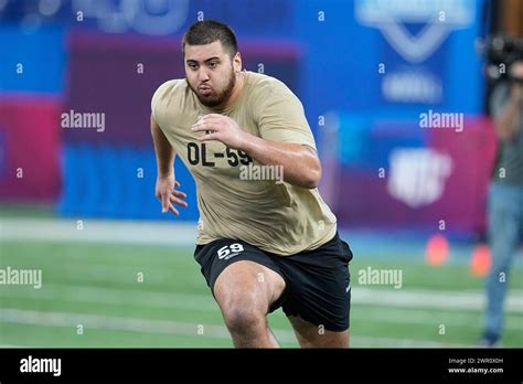 Kansas offensive lineman Dominick Puni runs a drill at the NFL football ...