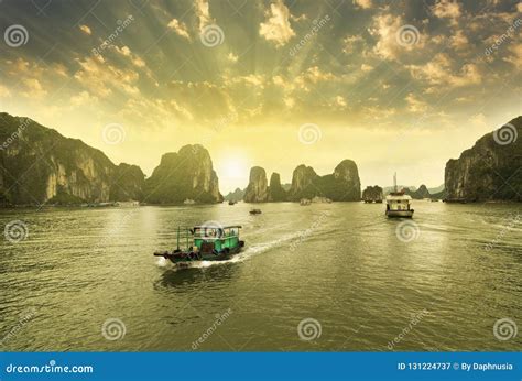 Boats, Sunset at Ha Long Bay Stock Image - Image of sunset, travel: 131224737